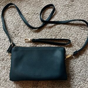 Small two-tone soft glove leather crossbody handbag.